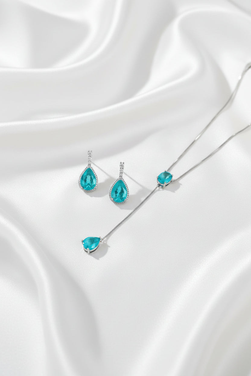 Turquoise teardrop jewelry set on a Vogue magazine