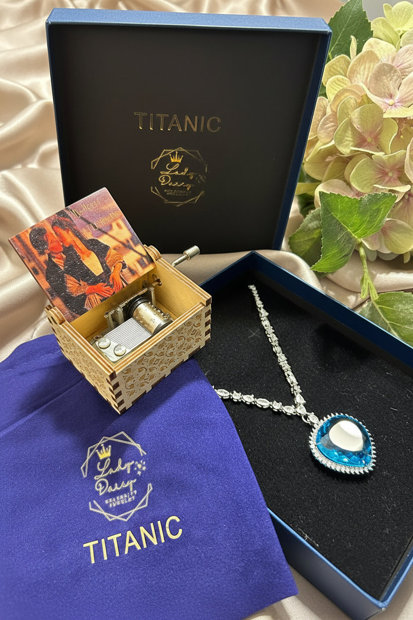 Jewelry set with a music box and necklace on a 'Titanic' themed surface